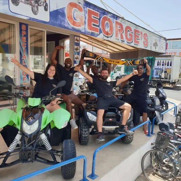Staff members of George's Quadbike showcasing their Bikes for rent.